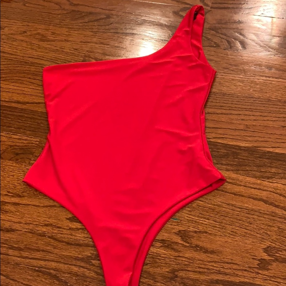 Red one shoulder bodysuit